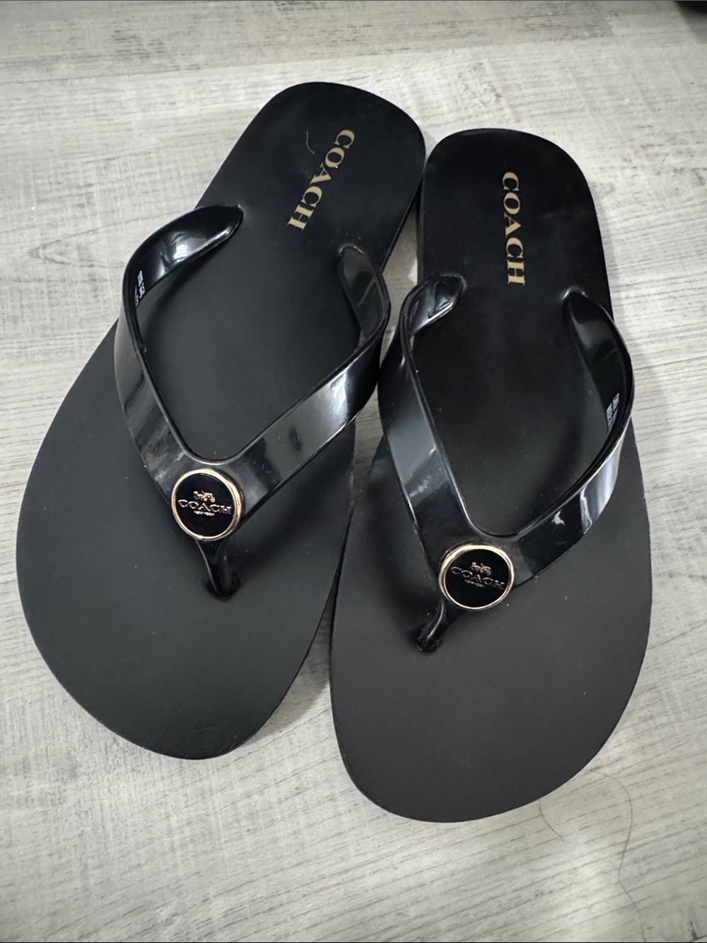 Coach Black Flip Flops with Gold Logo Medallions